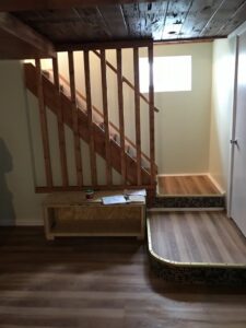 A newly built wooden staircase and landing inside a home, showcasing carpentry work by Advanced Seamless Gutters, Inc. in Chicopee, MA.