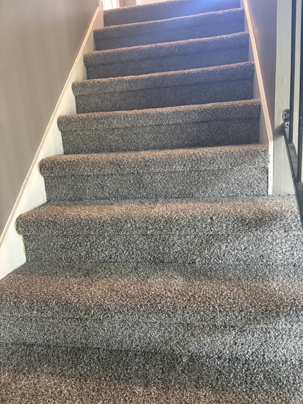 A newly carpeted staircase, showcasing quality flooring installation by DC Home Solutions in Atlanta, GA.