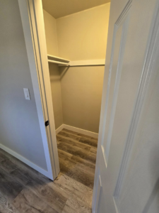 A newly installed closet shelf and hanging rod, part of a home improvement project by Next Level Finish in Fort Collins, CO.