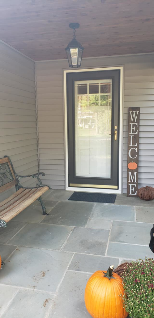 A newly installed front door with a glass insert, completed by Small Jobs Well Done in Avon, CT.