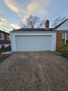 A newly installed garage door and renovated exterior by AIS Home Service's in St. Louis, MO.