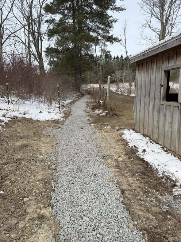 A newly installed gravel path or driveway completed by Naz General Contracting LLC in Schenectady, NY.