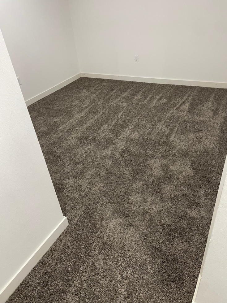 Newly installed gray carpet in a room by Prime Construction ent. in Bloomingburg, NY