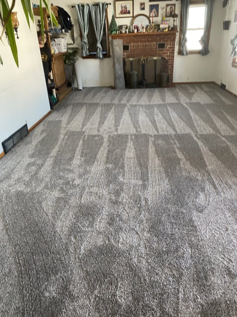 Newly installed grey carpet with fresh vacuum marks in a residential room by Creative Carpets in North Las Vegas, NV.