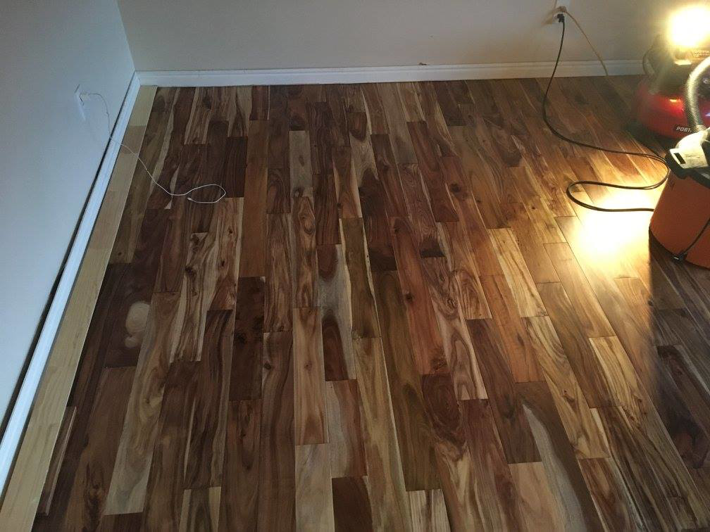 Recently installed hardwood flooring with drying equipment by E & E Handyman Services in Layton, UT.