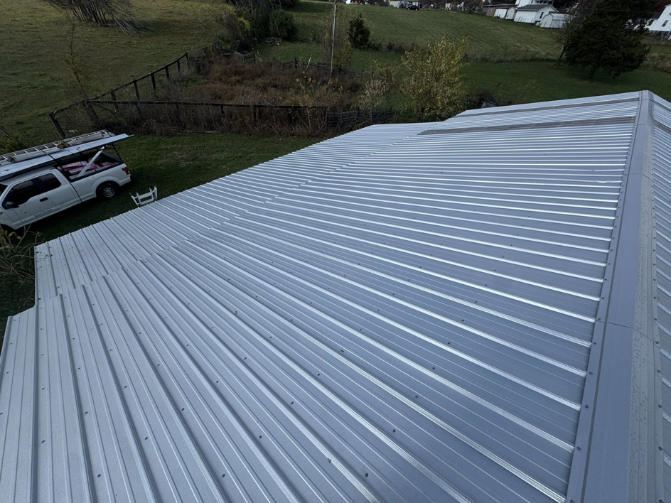 A wide view of a newly installed metal roof on a residential building, completed by Conway's Roofing in Richmond, KY.