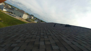 A newly installed residential roof with dark shingles, showcasing quality work by Xavier Roofing & Remodeling in Dayton, OH.