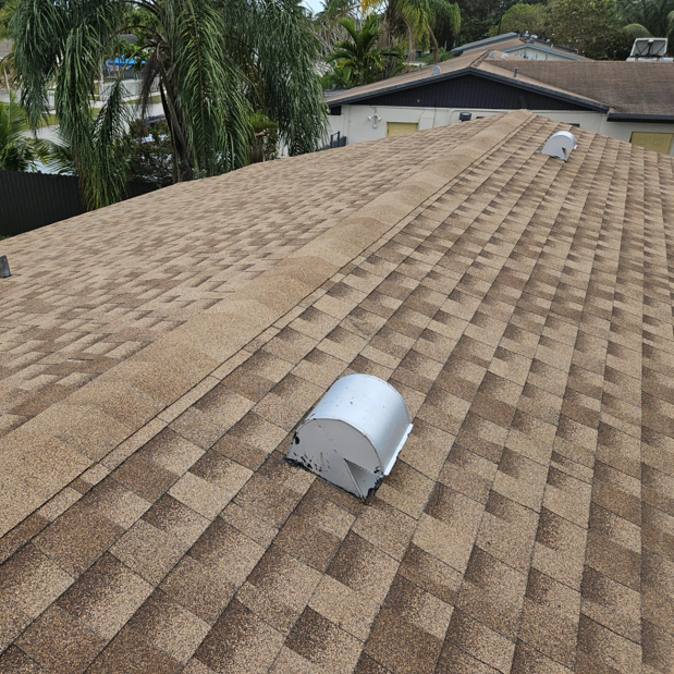 A newly installed shingle roof with vents, completed by Dreamland USA in Hialeah, FL
