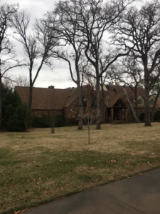 A large residential house with a newly installed shingle roof by TYCO Roofing & Construction LLC in Allen, TX.