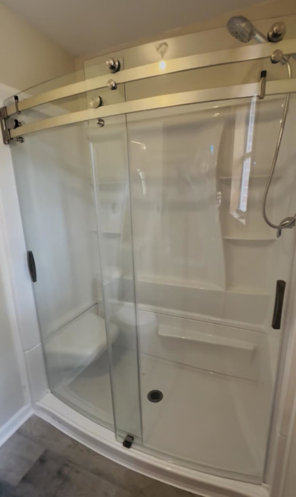 A newly installed glass shower enclosure, showcasing bathroom renovation services by NGU Contracting Solutions LLC in Albany, GA.