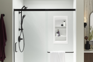 A newly installed shower with a black frame and built-in shelves by Pacific Bath in Portland, OR.