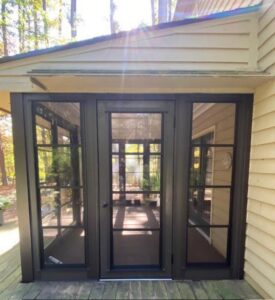 The exterior of a newly installed sunroom with dark frames, completed by X-Terior Techs in Henrico, VA.