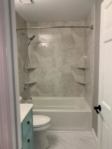 A newly installed tub and shower combination in a renovated bathroom by Bath Planet of STL & More in Saint Charles, MO.