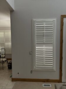 Newly installed white window shutters, a service provided by Rockin & Rollin Handyman Services in North Ogden, UT.