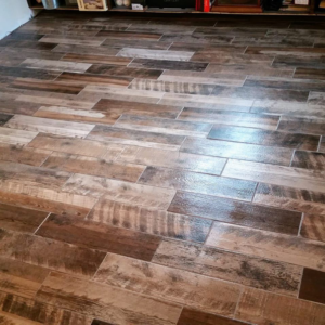 Newly installed wood-look plank flooring, showcasing a completed handyman job by Northup Flooring LLC in Greenville, SC.