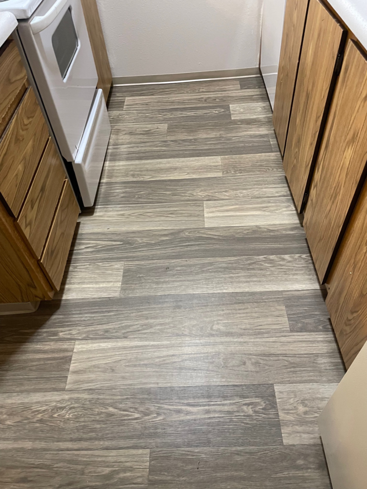 Newly installed wood plank flooring in a kitchen by Prime Construction ent. in Bloomingburg, NY