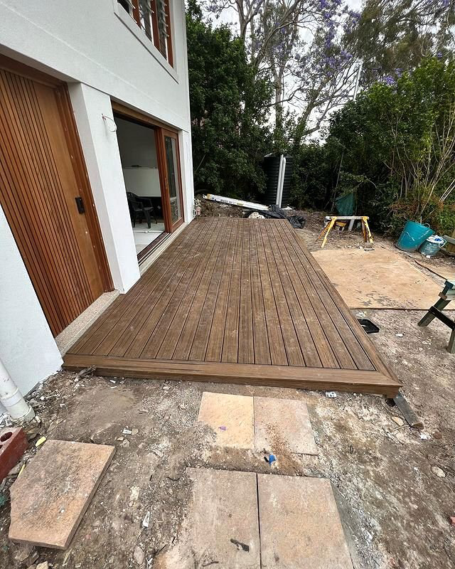A newly installed wooden deck next to a house, showcasing handyman work by All Service Group LLC in San Jose, CA