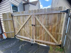 A newly installed wooden fence gate, a completed project by Handy Fix Co. in Cleveland, OH.