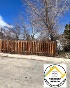 A newly installed or repaired wooden fence along a street by Northern Nevada Handyman Repairs LLC in Reno, NV