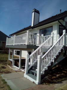 A newly painted deck and stairs on a house exterior by Picasso Handyman Painters in Wichita, KS.
