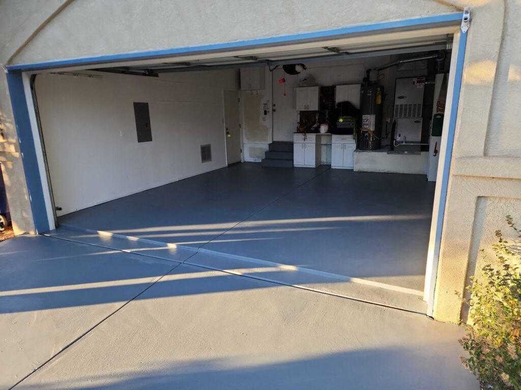 A newly painted or sealed garage floor, a completed project by Ace Handyman ABQ SF in Albuquerque, NM