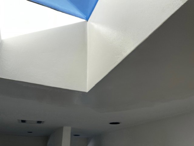 A newly painted skylight shaft, showcasing painting services by San Marcos Drywall and Paint in Austin, TX