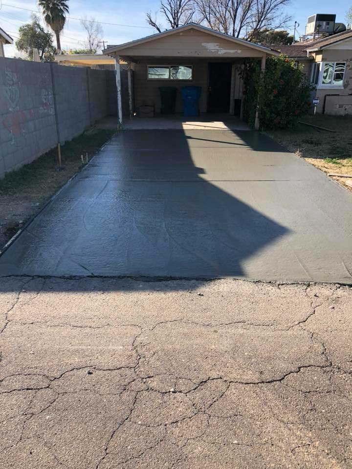 A newly poured concrete driveway installation completed by Ken's Masonry, LLC in Chandler, AZ.
