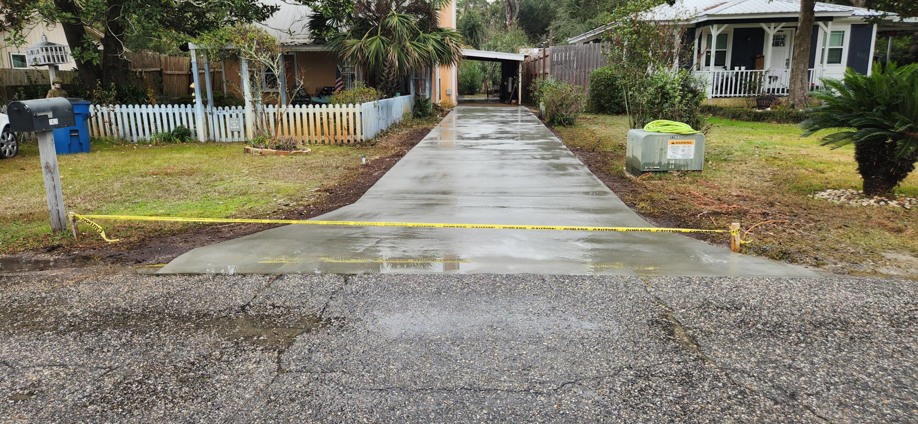 A newly poured concrete driveway completed by Unified Services & Sales LLC in Pelham, AL