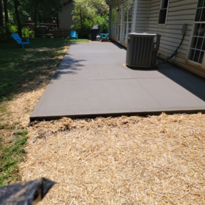 A newly poured concrete patio installed by Swift Remodeling South in Charlotte, NC.