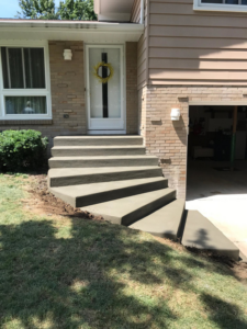 Newly poured concrete steps leading to a house entrance by Paris Brothers & Company, Inc in Erie, PA