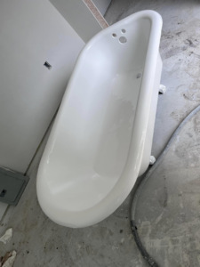 A newly refinished white clawfoot tub by Immaculate Refinishing in Arlington, TX.