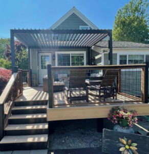 A newly renovated deck with a modern pergola and outdoor furniture by Imagine Construction & Home Remodeling in Lexington, KY.