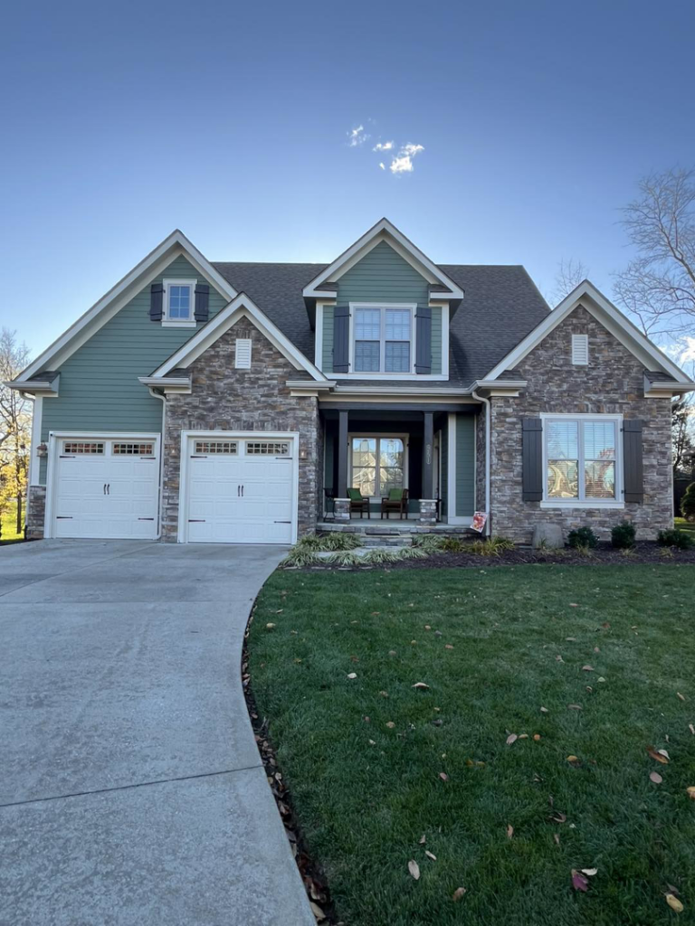 The beautiful front exterior of a newly renovated house completed by PrimeTime Painting in Bowling Green, KY.