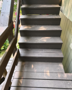 A newly repaired wooden staircase, showcasing quality work by Blackcap Handyman in Portland, ME.