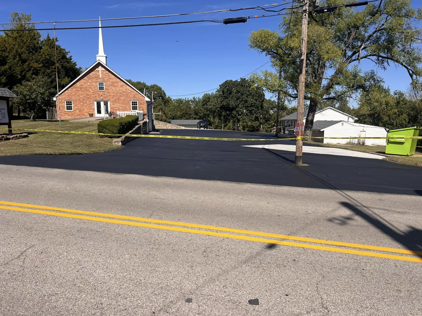 A newly sealcoated asphalt parking lot in front of a church by Gorman sealcoating & striping in Blue Springs, MO.