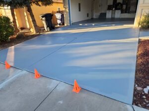 A newly sealed or painted driveway and garage floor, a service by Ace Handyman ABQ SF in Albuquerque, NM
