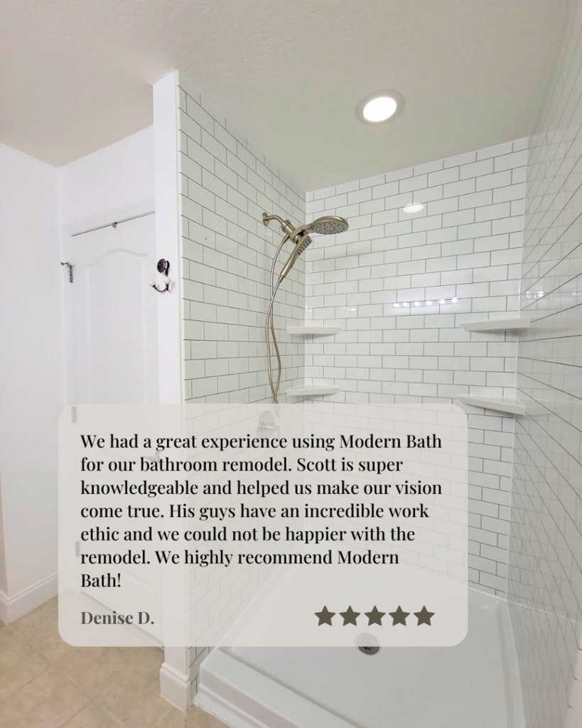 A newly tiled shower with subway tiles and shelves, showcasing a bathroom remodel by Modern Bath, LLC in Knoxville, TN.