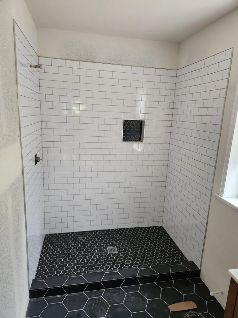A newly tiled shower installation in progress by Becker Custom Construction - pdx in Oak Grove, OR.