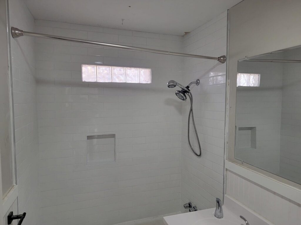 A newly tiled shower and bathtub area, showcasing bathroom renovation by Friendly Handyman LLC in Wichita, KS