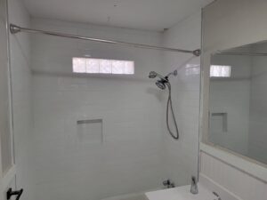 A newly tiled shower and bathtub area, showcasing bathroom renovation by Friendly Handyman LLC in Wichita, KS