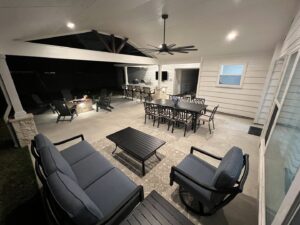 A stunning night view of a completed outdoor living space by Houston Home Improvements & Construction in Houston, TX