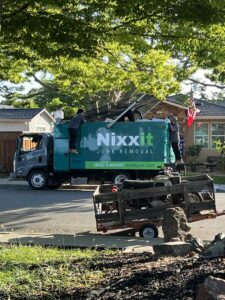 The Nixxit Junk Removal crew loading large, bulky items onto their truck during a job in Castro Valley, CA.