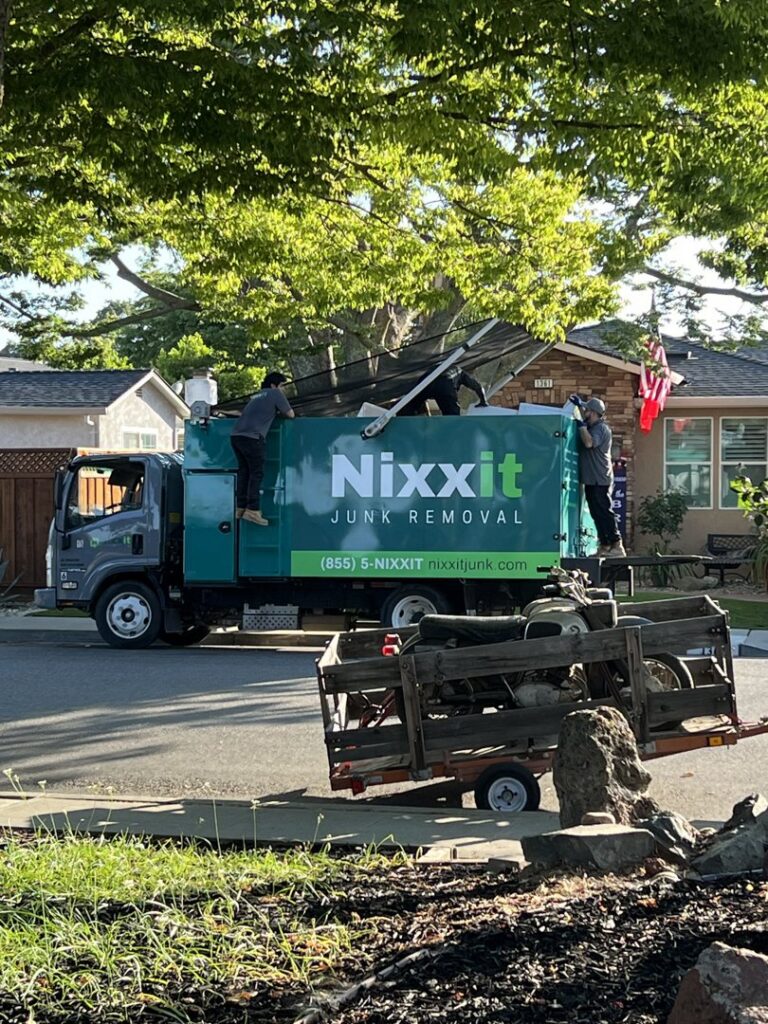 The Nixxit Junk Removal crew loading large, bulky items onto their truck during a job in Castro Valley, CA.