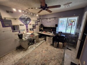 A cluttered office space undergoing a cleanout, ready for junk removal by Westish Junk Removal LLC in Orlando, FL.