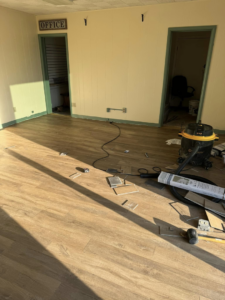New flooring being installed in an office space by Wheeler's Handyman Services in Vermillion, SD