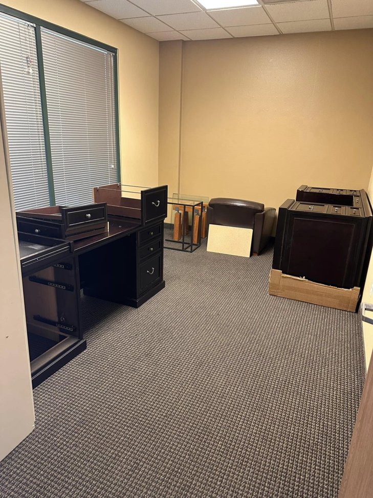 Office furniture including desks and cabinets ready for cleanout and removal by HD Junk Removal in Gilbert, AZ