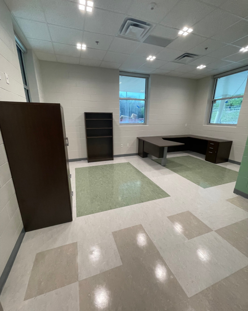 A newly installed office desk and cabinets in a commercial space by Jez Enterprises in Aurora, CO.