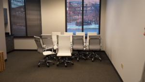 An office room with multiple white office chairs set up by DCI - Deason Contracting & Installations in St. Louis, MO