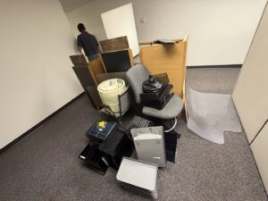 A pile of old office furniture and equipment ready for commercial junk removal by Junk Holler in Boise, ID.