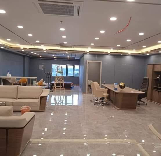 An office space with new lighting and an AC unit installed by Electrician on Call and Home Service in Taguig, PH.